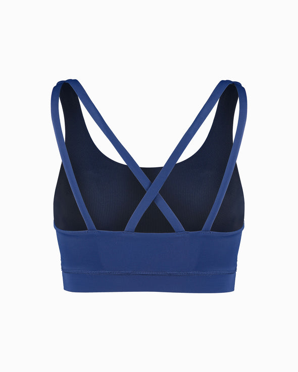 Scultura Activewear blue sustainable women’s sports bra. Women’s Activewear made to last with ECONYL Regenerated Yarn created with recovered fishing nets.  back view featuring cross back straps.