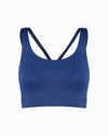 Blue sustainable women’s sports bra. Women’s Activewear made to last with ECONYL Regenerated Yarn created with recovered fishing nets.  Front view.