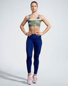 Camufarre Sustainable Sports Bra with cross back straps. Featuring a unique camo activewear print created with a purpose by Scultura. Inspired by the ocean and designed to raise awareness of the environmental impact of single use plastic. Created with premium technical Italian fabric made with 100% regenerated yarn from recycled plastic bottles (rPET). Front View.