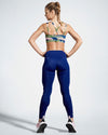 Ladies Camufarre Sustainable Sports Bra with cross back straps. Featuring a unique camo activewear print created with a purpose by Scultura. Inspired by the ocean and designed to raise awareness of the environmental impact of single use plastic. Created with premium technical Italian fabric made with 100% regenerated yarn from recycled plastic bottles (rPET). Back View featuring straps.