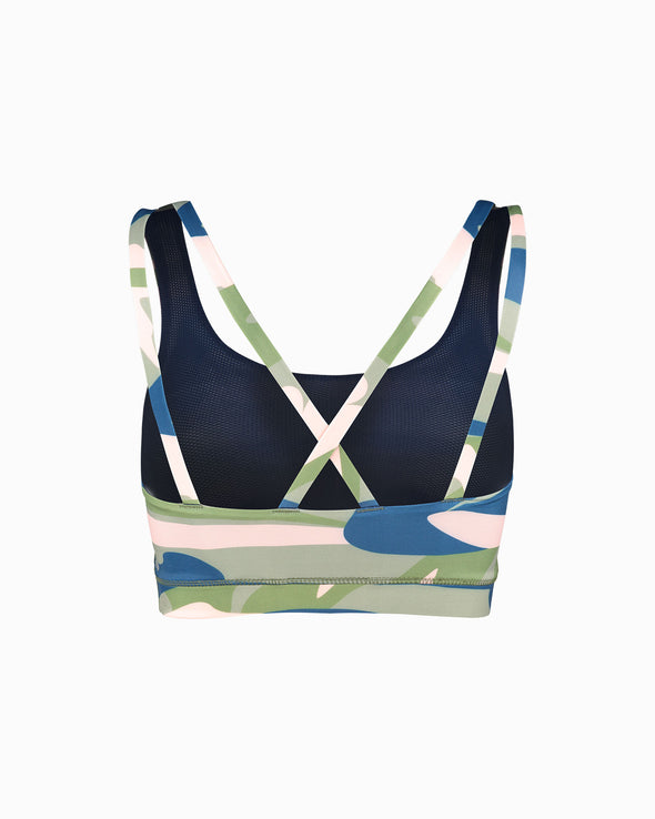 Product shot of Camufarre Sustainable Sports Bra with cross back straps. Featuring a one off camo activewear print created with a purpose by Scultura. Inspired by the ocean and designed to raise awareness of the environmental impact of single use plastic. Created with premium technical Italian fabric made with 100% regenerated yarn from recycled plastic bottles (rPET). Back view featuring straps.