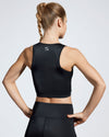 Debutto sustainable gym crop in black. Made with premium Italian Fabric created with ECONYL Regenerated Yarn. Back view.
