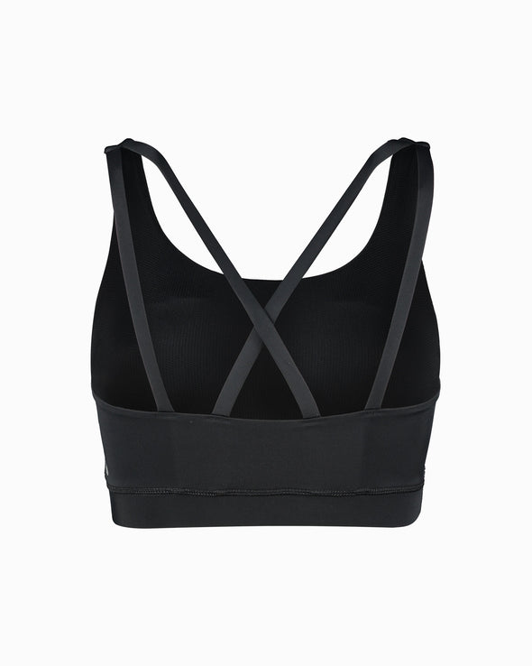 Product shot of black sustainable women’s sports bra. Women’s Activewear made to last with ECONYL Regenerated Yarn created with recovered fishing nets.  Back view.