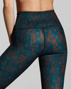 Close up of Sienna leggings print. Dark blue and burnt orange gym leggings print. Sports wear luxury sustainable printed leggings. 