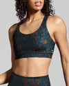Sienna print ladies gym bra. Made with sustainable fabric. Dark ocean blue and burnt orange sportswear print from New horizons activewear collection.