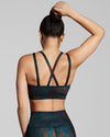 Sienna print sustainable sports bra with cross back straps . Printed luxury gym bra made with fabric from recycled yarn.