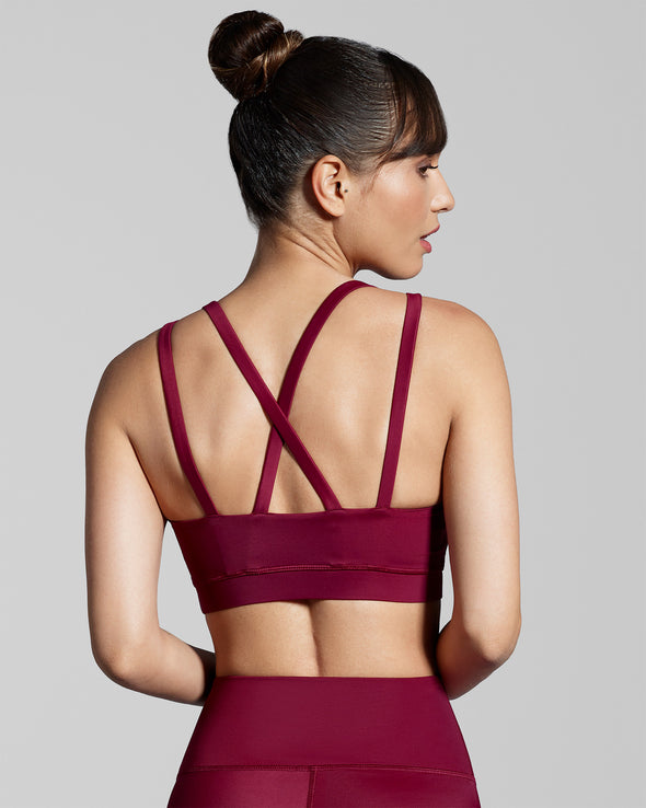 True Berry burgundy red gym sports bra. Designed with fabric made with ECONYL® regenerated yarn.  New Horizons sports bra in claret red.