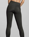 Sustainable pebble grey gym leggings for women. Dark grey fitness clothes for women. Close up of eco friendly grey activewear.