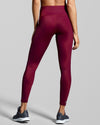 Back view of recycled gym leggings in true berry. Designed with fabric made with ECONYL® regenerated yarn.