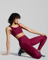 New Horizons gym leggings and sports bra in true berry. Luxury sustainable gym set. Gym leggings and sports bra in berry red. 
