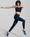 Women's Leggings and sports bra in deep blue. Premium sustainable gym wear. Navy blue leggings and sports bra.